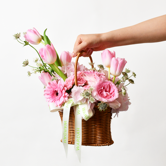 pink flowers arrangement in basket