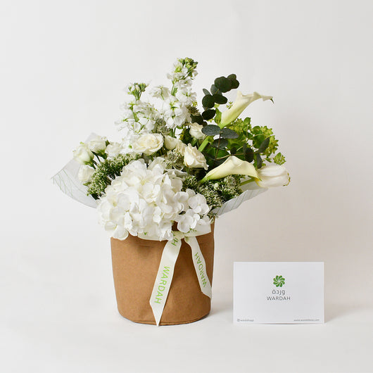 white flowers arrangement in a vase 
