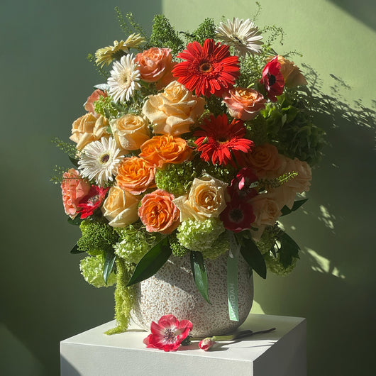 PEACH RED AND WHITE FLOWERS ARRANGEMENT IN A VASE