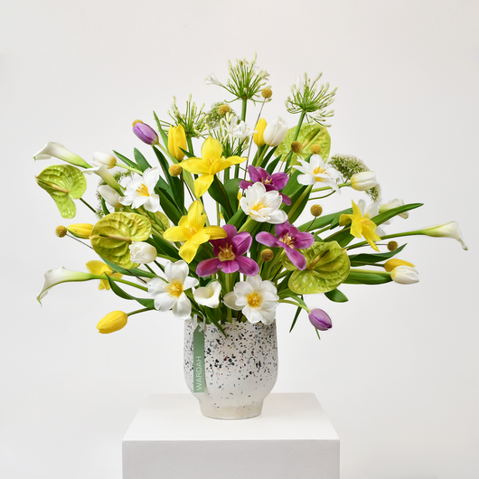 tulips calla and anthurium arrangement in a vase