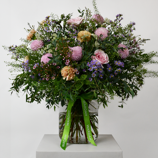 pastel and green flowers arrangement in big vase