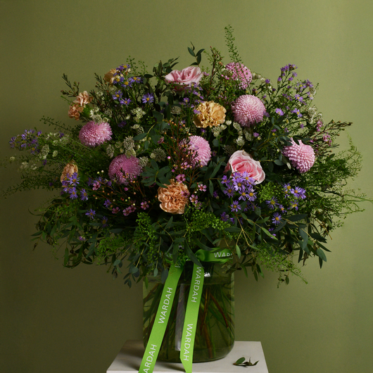 pastel and green flowers arrangement in big vase