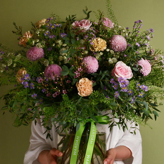 pastel and green flowers arrangement in big vase