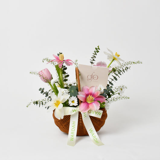 flowers arrangement in a basket with gift card