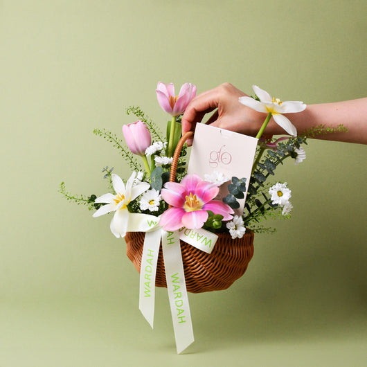 flowers arrangement in a basket with gift card