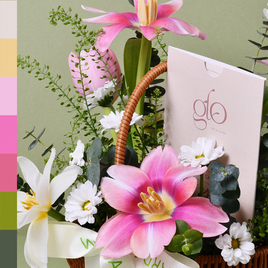 flowers arrangement in a basket with gift card