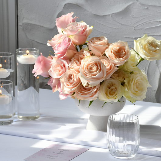 classic roses in white vases table setup