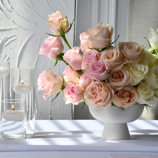 classic roses in white vases table setup
