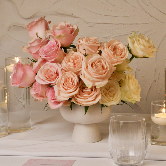 classic roses in white vases table setup