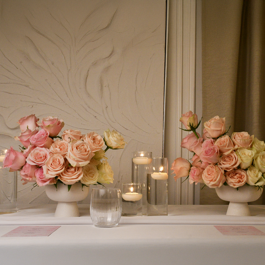 classic roses in white vases table setup