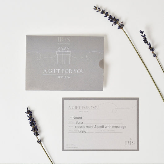 Iris spa gift card with arrangement flowers in a tray