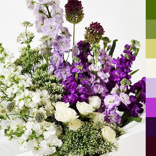 white and purple matthiola arrangement in vase