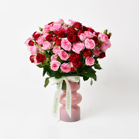 pink and red baby roses in vase