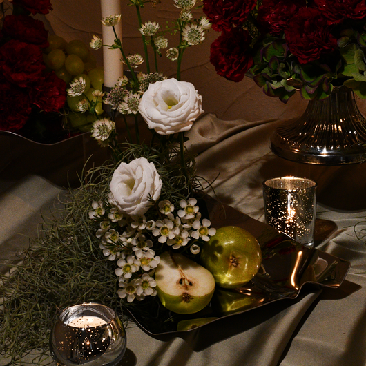 elegant red, green and white table setup arrangement  