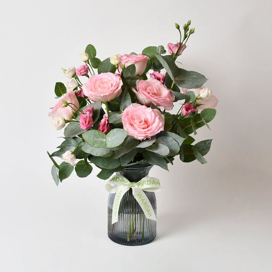 PINK ROSES AND EUCALYPTUS IN A VASE