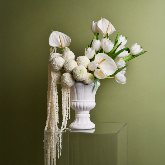 white arrangement in white vase 