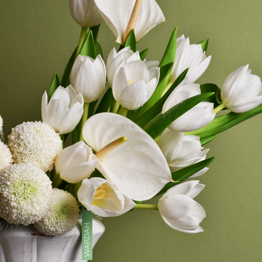 white arrangement in white vase