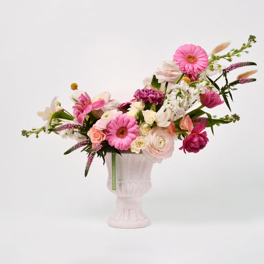 white and pink flowers arrangement vase