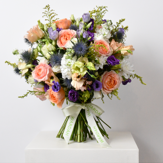 PEACH ROSES BLUE EUSTOMA SOLIDAGO AND WHITE FLOWERS ARRANGEMENT HAND BOUQUET